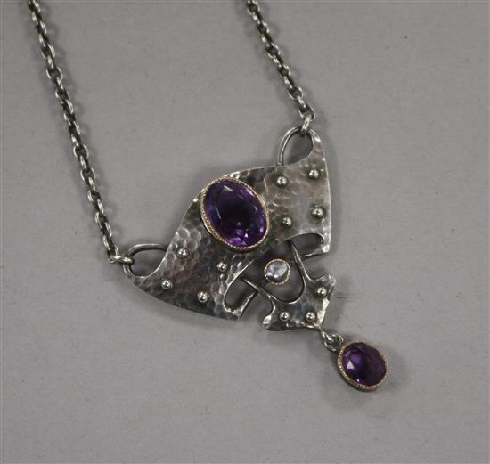 An early 20th century Arts & Crafts 950 standard white metal and amethyst set drop pendant by Murrle Bennett,